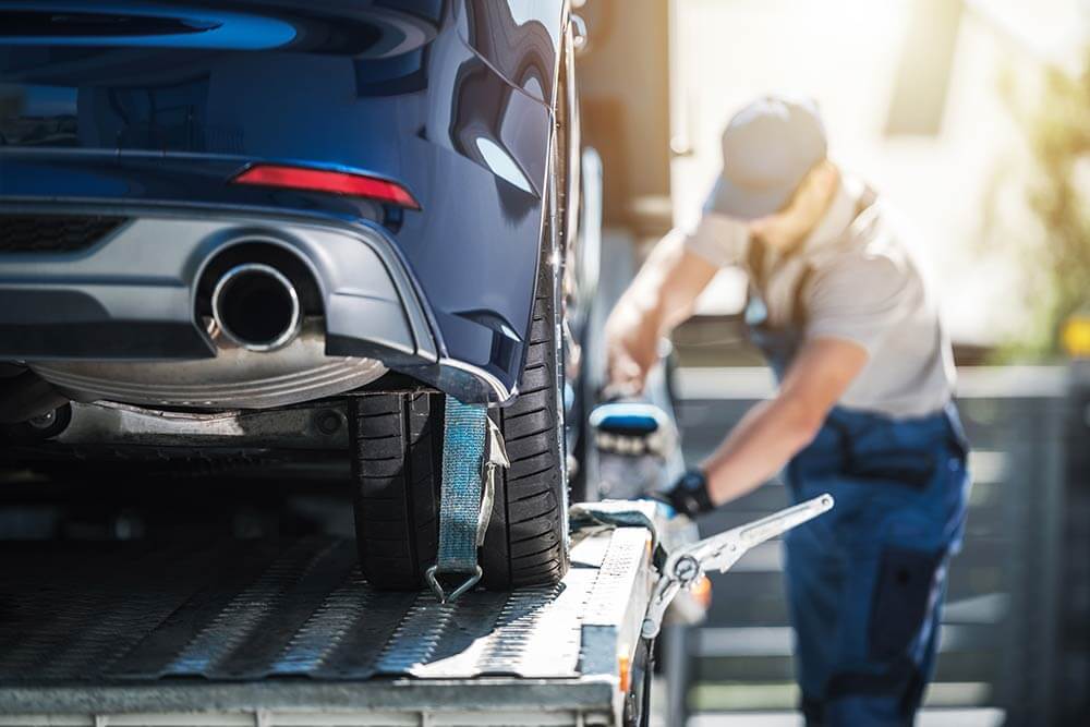 Man preparing car for shipping. Moving car across the country.