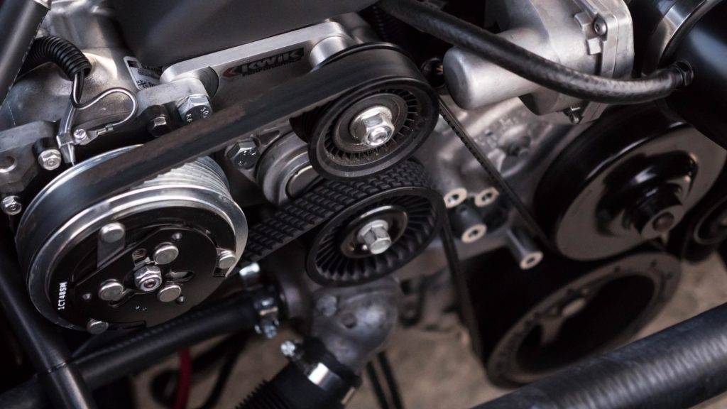 A close-up picture of an engine. car ship cost